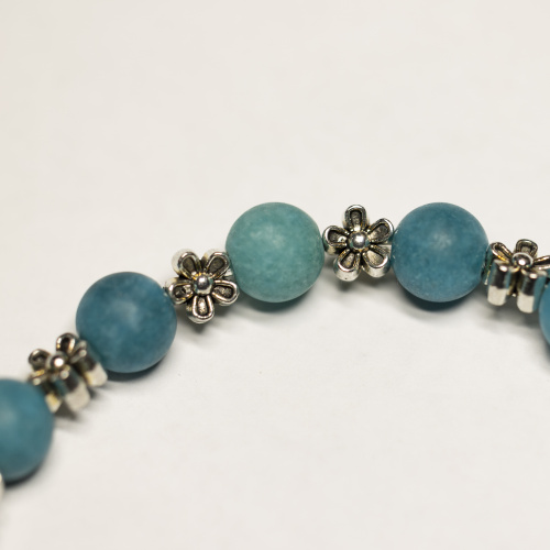 Blauer Kunststein 8 mm matt mit Blumen Elementen
